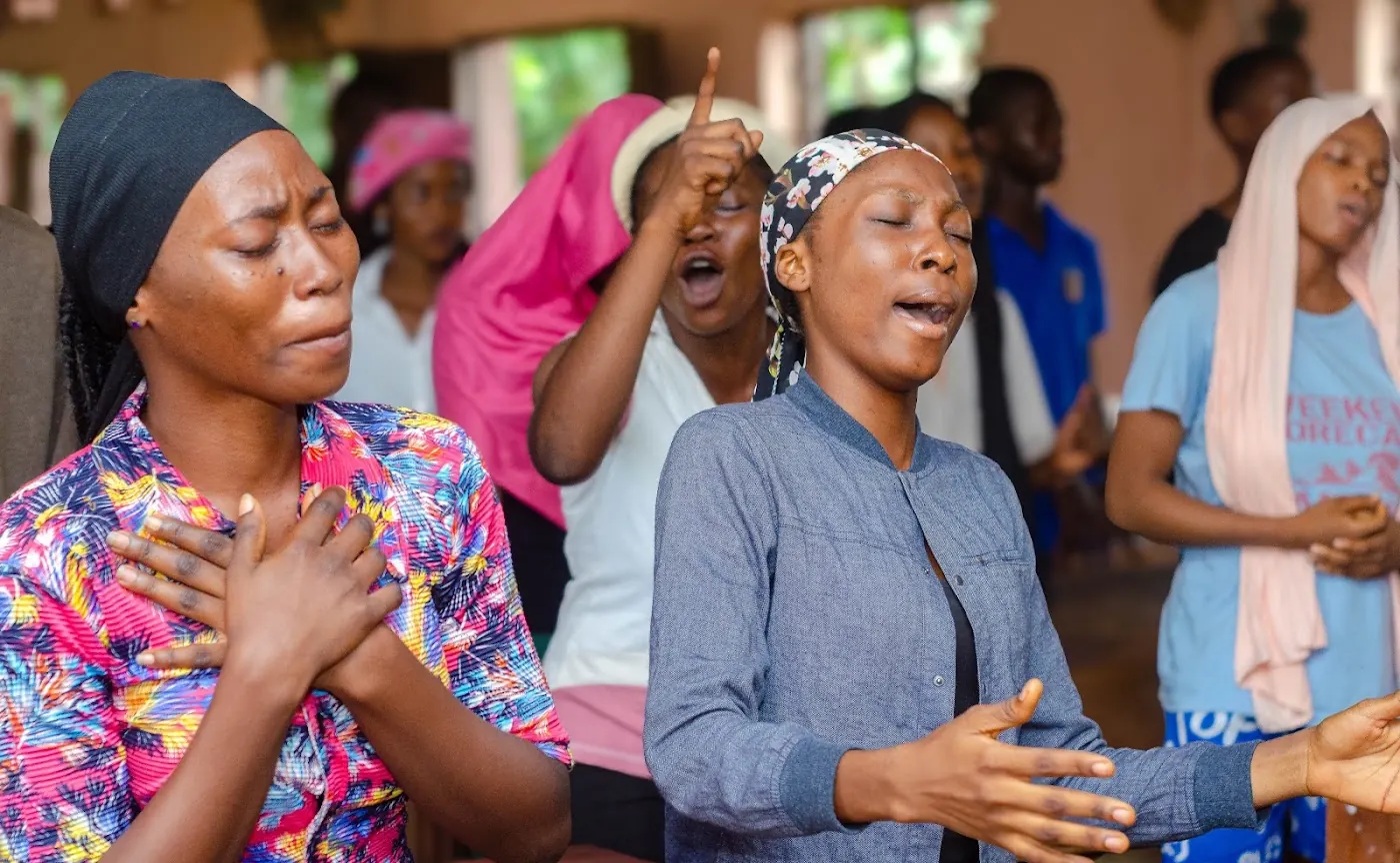 Worship & Word 2026 · New Wine: worshippers praying and praising at Adoration New Life Ministry, Aiyepe, Ijebu
