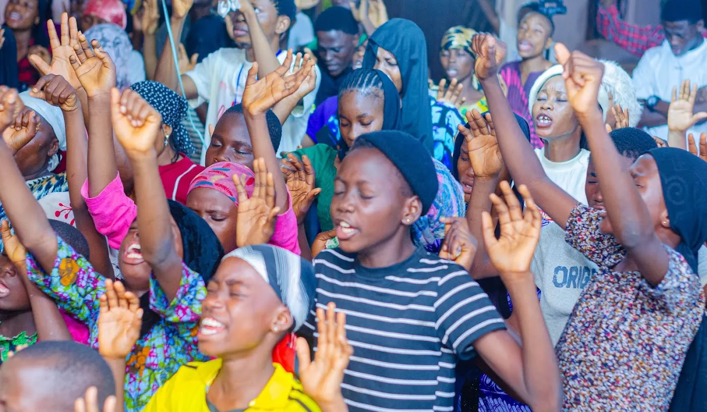 Worship & Word 2026 · New Wine: worshippers praying and praising at Adoration New Life Ministry, Aiyepe, Ijebu